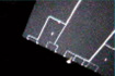 放出されたミネルバが撮影した「はやぶさ」の太陽電池パドル