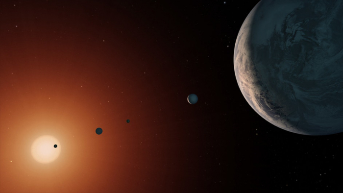 This illustration shows what the TRAPPIST-1 system might look like from a vantage point near planet TRAPPIST-1f (at right). Credit: NASA/JPL-Caltech 