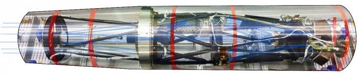 図１　CLASP観測装置。カセグレン望遠鏡（TL、左側）・偏光分光装置（SP、右側）・モニター光学系（SJ、中央上部）がロケット外筒の中に搭載されている様子（合成によりロケット外筒を半透明にしている）。